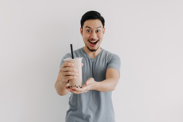 Asian man is feeling happy with his Boba tea isolated on white background.