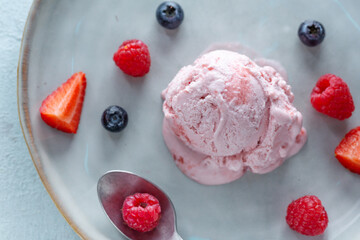 Fruity ice cream scoop on plate