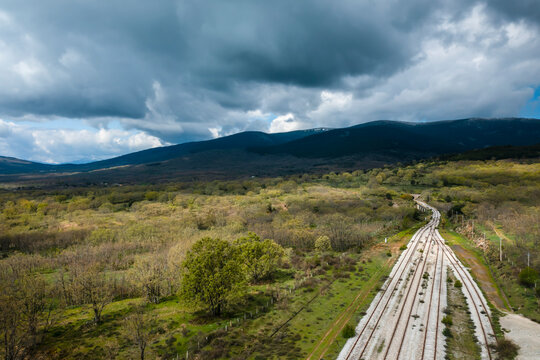 Ancient train tracks landscape. Horizontal aerial photography with drone. Concept of life, destiny or direction to follow, thought, reflection, meditation. Selective focus