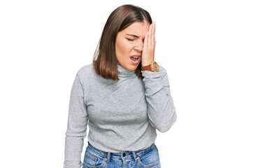 Fototapeta premium Young beautiful woman wearing casual turtleneck sweater yawning tired covering half face, eye and mouth with hand. face hurts in pain.