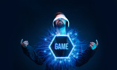 Man on dark virtual reality background. Guy using VR helmet. Augmented reality, future technology, game concept. Blue neon light. Futuristic holographic interface to display data.