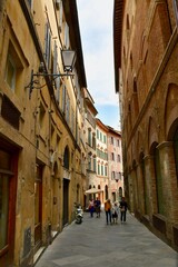 Narrow Walking Street Alley in Tuscany with Ochre-Colored Buildings