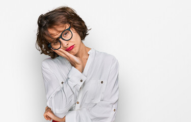Young hispanic woman wearing business style and glasses thinking looking tired and bored with depression problems with crossed arms.