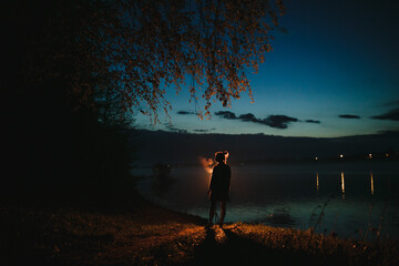 Silhouette of a girl at night.