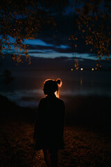 Silhouette of a girl at night.