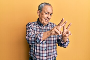 Handsome senior man with grey hair wearing casual shirt smiling looking to the camera showing fingers doing victory sign. number two.