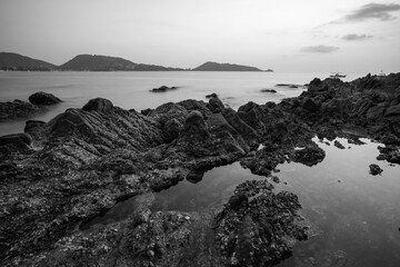 Long exposure of seascape scenery with rocks in black and white,beautiful image can be used nature composition for background and wallpaper