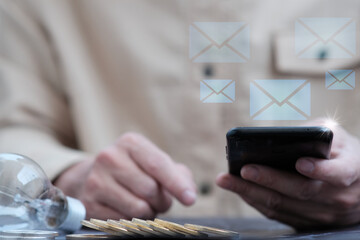 Businessman working on smartphone, email marketing concept, person reading e-mail on smartphone,...