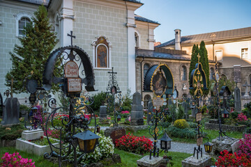Salzburg, Austria, October 2018 - View of some graves at Petersfriedhof (St. Peter's Cemetery) 