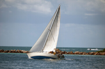 sailboat heading to the open ocean
