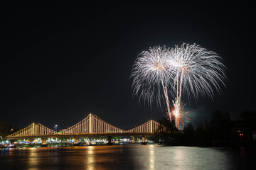 SURATTHANI, THAILAND - OCTOBER 17 : Beautiful firework display for celebration on the Tapee river on parades in Chak Phra Festival on October 17, 2015 in Suratthani, Thailand.