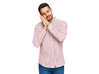 Young hispanic man wearing business shirt sleeping tired dreaming and posing with hands together while smiling with closed eyes.