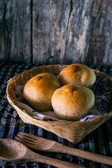 Homemade sourdough bread on a dark table with a napkin