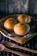 Homemade sourdough bread on a dark table with a napkin