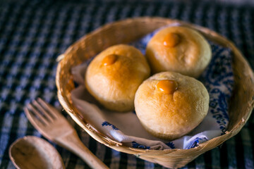Homemade sourdough bread on a dark table with a napkin