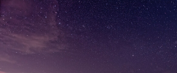 Purple night sky full of stars as background