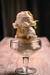 cream ice cream with dulce de leche caramel and wafer