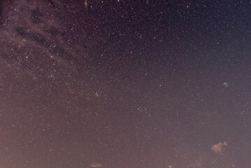 Purple night sky full of stars as background