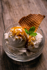 cream ice cream with dulce de leche caramel and wafer