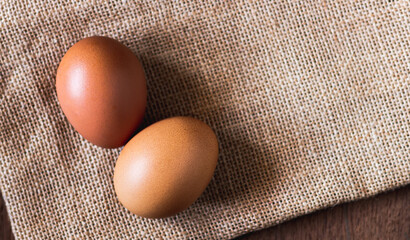 Top view of eggs on sackcloth background