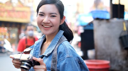 Traveler Asian blogger women travel in Bangkok, Thailand, beautiful female using mobile phone make vlog and live in social media .woman tourist making video call with smartphone.