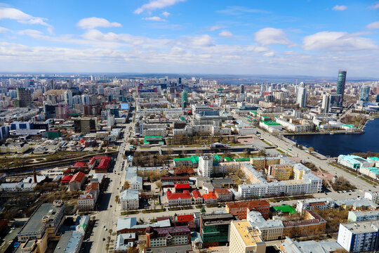 City landscape on a sunny day against the blue sky. Clouds float across the sky. Svehru view of the city 