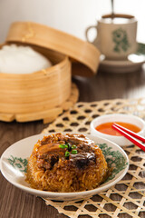 Dim Sum Loh Mai Kai. Steamed Glutinous Rice with chicken mushrooms and sausage