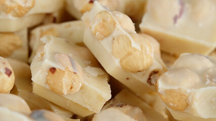 crushed white chocolate with nuts close up