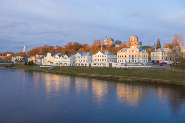 Obraz premium View of the city embankment on a April evening. Torzhok, Tver region. Russia