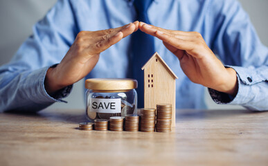 Insurance house, and family health live concept. The insurance agent presents  the ้hands...