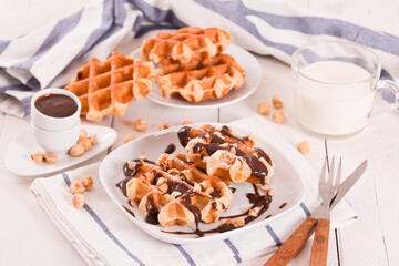 Waffles with chocolate cream and hazelnuts.