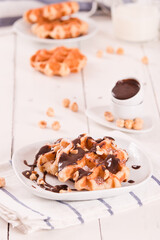 Waffles with chocolate cream and hazelnuts.