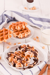 Waffles with chocolate cream and hazelnuts.