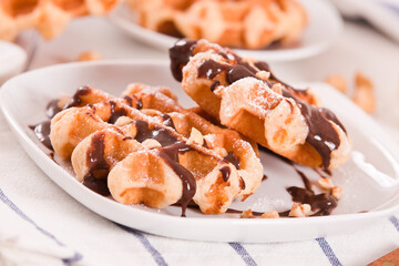 Waffles with chocolate cream and hazelnuts.