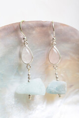 Raw stone mineral earrings on white background