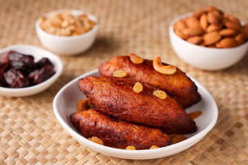 Unnakkaya , banana rolls,  popular Kerala snack for Ramadan Kareem, India, sri Lanka . Traditional Iftar food dish Malabar Muslim feast. Holy month of Ramadan. tea time snack