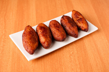 Unnakkaya , banana rolls,  popular Kerala snack for Ramadan Kareem, India, sri Lanka . Traditional Iftar food dish Malabar Muslim feast. Holy month of Ramadan. tea time snack