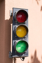 Green traffic light on wall intersection garage residential entrance