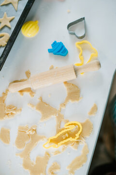 Topview Of Kitchen Table With Pastry, Cookie Cutters, Rolling Pin And Baling Pan. Making Homemade Cookies Concept.