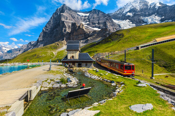 Fototapeta Cogwheel tourist train in the mountain station, Jungfraujoch, Switzerland obraz