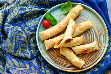 Deep Fried Turkish Cigar Shaped Rolls - Spring roll Sigara Borek.  Fried dough borek   with minced meat