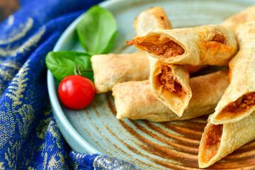 Deep Fried Turkish Cigar Shaped Rolls - Spring roll Sigara Borek.  Fried dough borek   with minced meat
