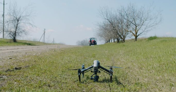  modern, military drone, landing on the ground on the grass, waiting to take off