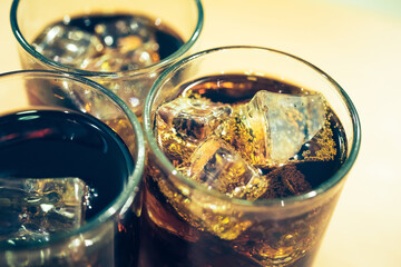 Refreshing Bubbly Soda Pop with Ice Cubes. Cold soda iced drink in a glasses - Selective focus, shallow DOF	
