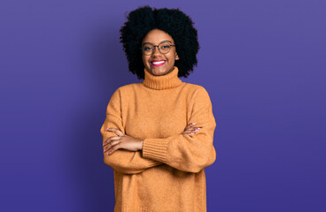Fototapeta na wymiar Young african american woman wearing casual clothes happy face smiling with crossed arms looking at the camera. positive person.
