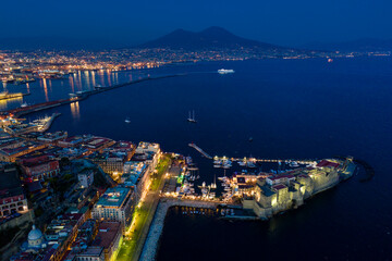 Fototapeta premium The colourful city of Naples at dusk