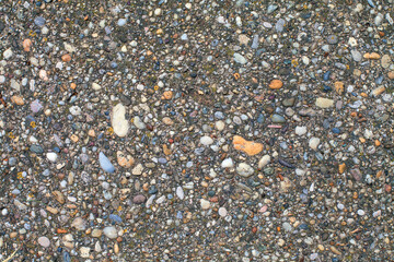 Homemade Exposed Aggregate Concrete. Beton with visible brash texture. Photographic pattern of dense ballast concrete. Gray rabblework bg image, top view. Strong concrete surface. Site concrete floor