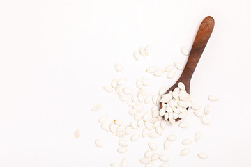 Heap of pumpkin seeds isolated on white background