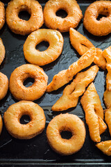 Homemade golden donuts freshly baked. Homemade pastries for Fat Thursday.