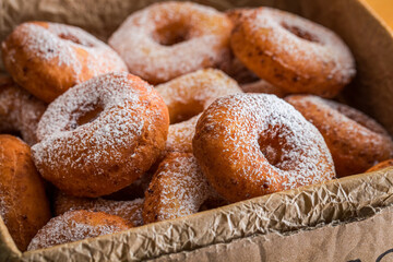 Homemade donuts in a box. Homemade pastries for Fat Thursday.
